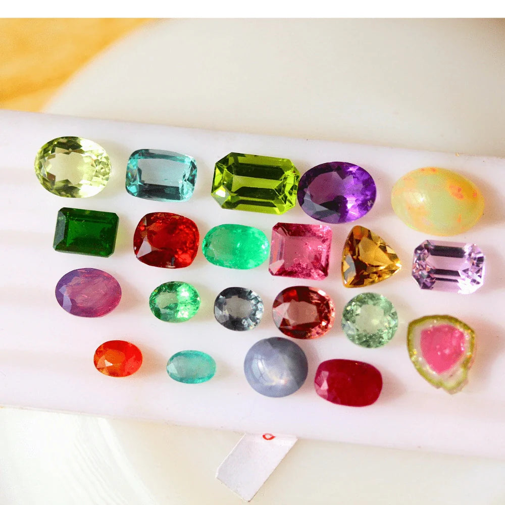 21 Pieces Multi Loose Cut Gemstones: Emerald, Ruby, Sapphire, Garnet, Aqua, Tourmaline