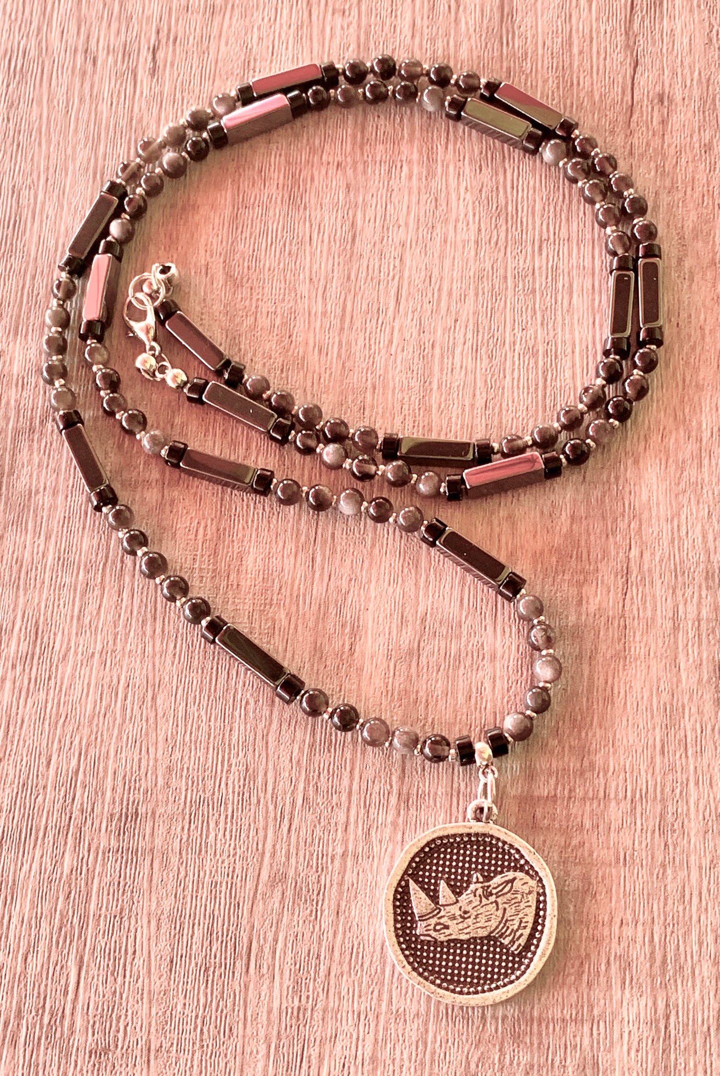 Sudan Handmade Silver Obsidian, Hematite, and Black Quartz 29" Necklace with Rhino Coin Pendant