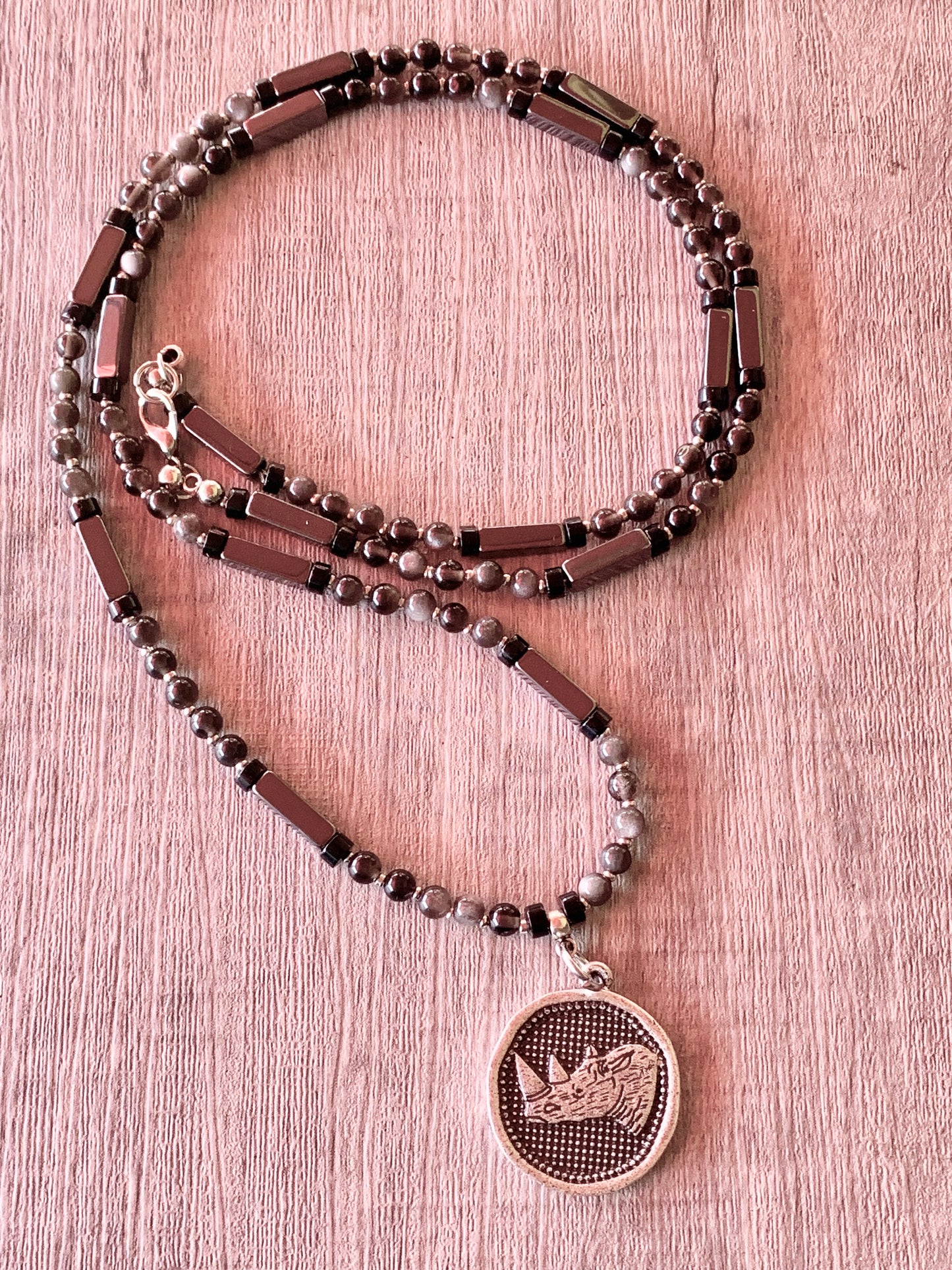 Sudan Handmade Silver Obsidian, Hematite, and Black Quartz 29" Necklace with Rhino Coin Pendant