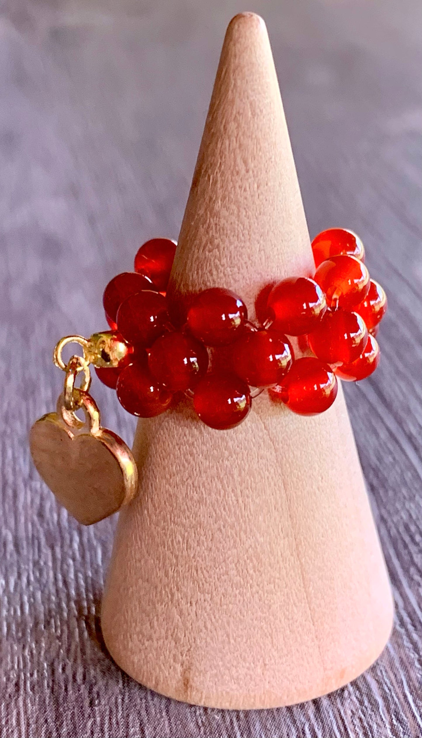 🔴SOLD🔴Phoenix Handmade Carnelian and Gold Hematite Expandable Ring with Dangle Heart Charm