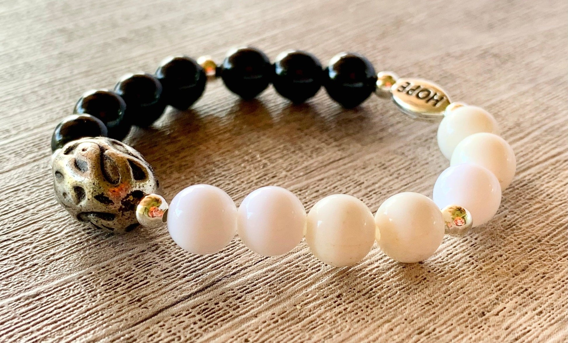 https://www.bornmystics.com/cdn/shop/products/anthony-handmade-acrylic-beaded-expandable-6-bracelet-with-silver-spacer-beads-for-kids-4-8-years-old-624595.jpg?v=1676863734&width=1946