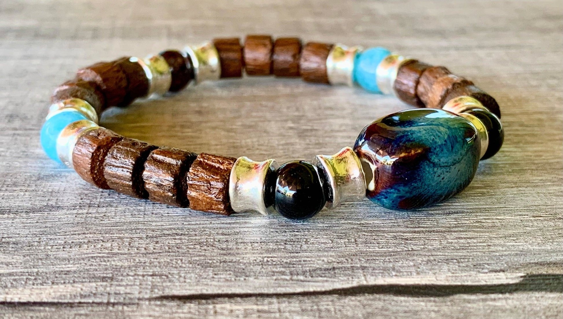Marcus Handmade Wood, Garnet, Aquamarine, and Black Tourmaline Expandable Bracelet with a Ceramic Center Piece - Born Mystics