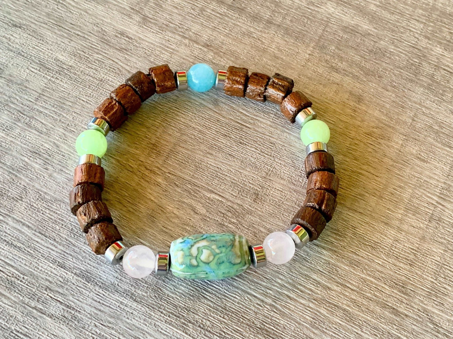 Edward Handmade Wood, Rose Quartz, Light Green Jade, Aquamarine, and Hematite Expandable Bracelet with a Ceramic Center Piece